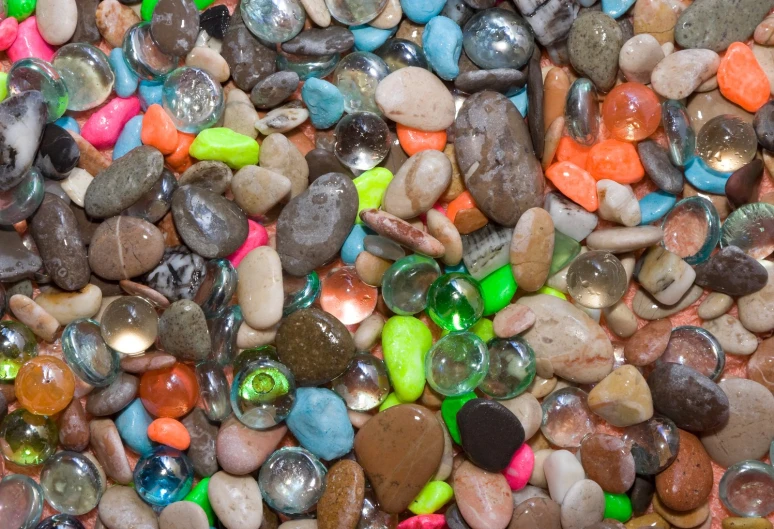small rocks are arranged together and all different colors