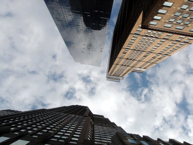 two tall buildings with sky in the background