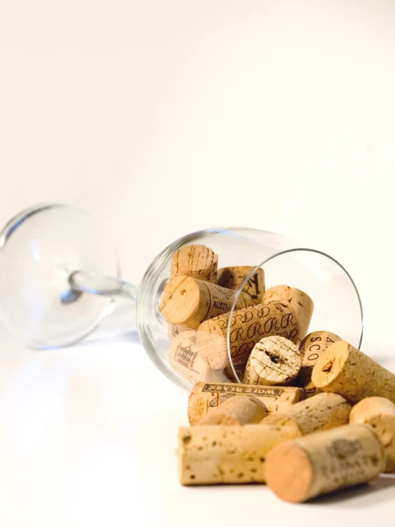 some wine corks sitting inside a glass bottle