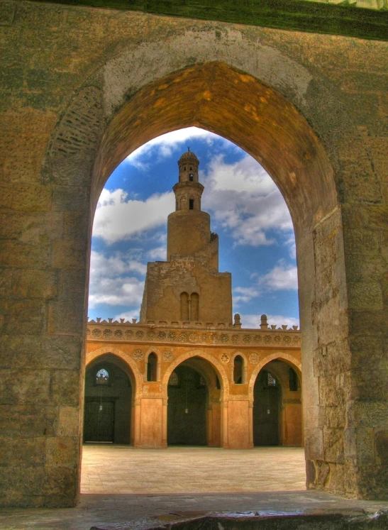 an archway leads into the courtyard of a medieval building