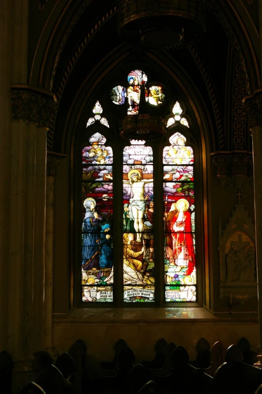 the stained glass window inside the church depicts the birth of jesus