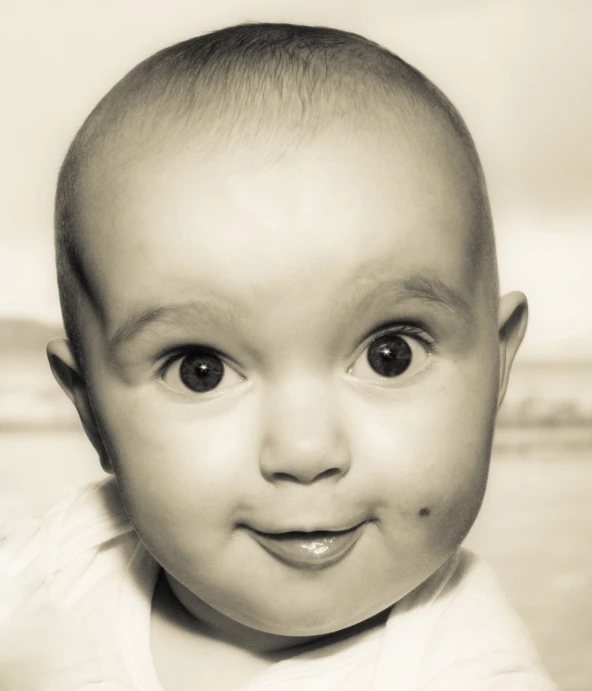 black and white pograph of baby with big eyes