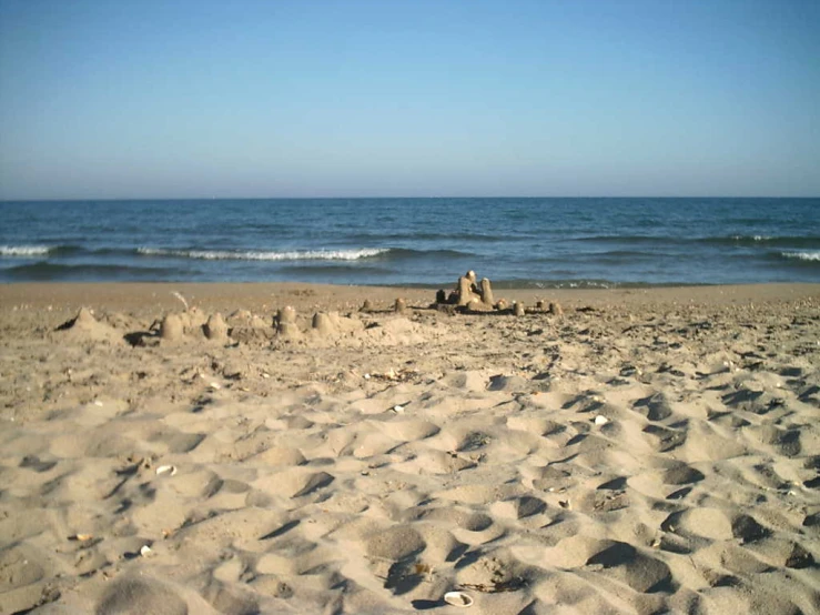 there is an empty beach on a sunny day