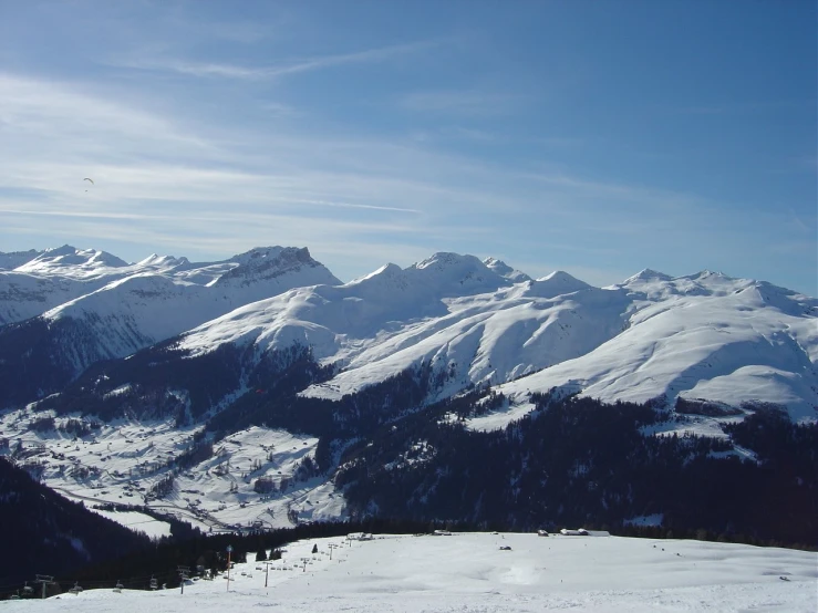 the view of a snowy mountain from a ski slope