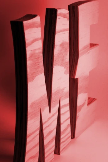 a cut out letter m on a red background