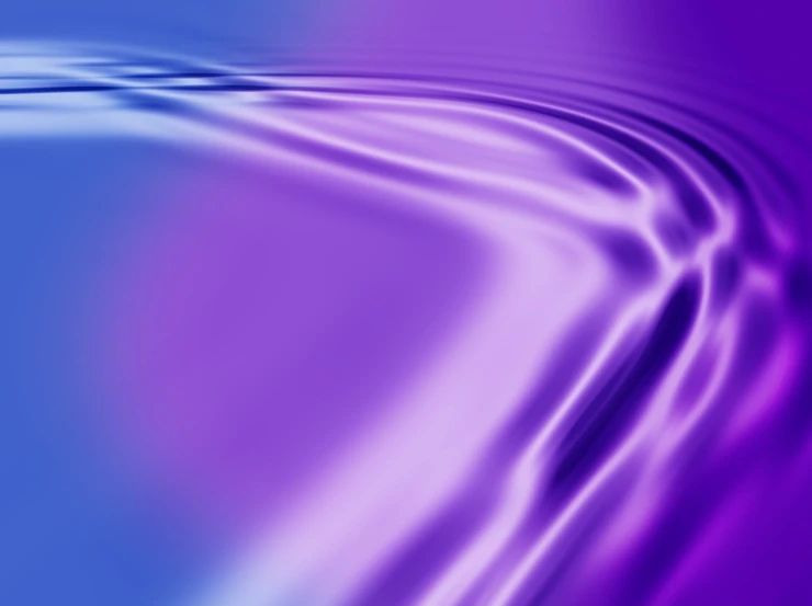 a blue and purple background with water droplets