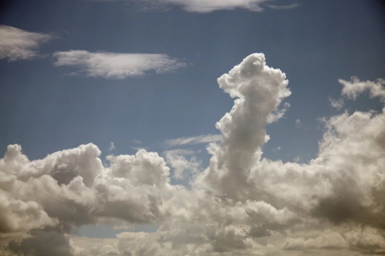 clouds move in the blue sky on a sunny day