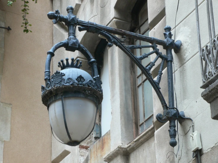 a street light hangs from the side of an apartment building