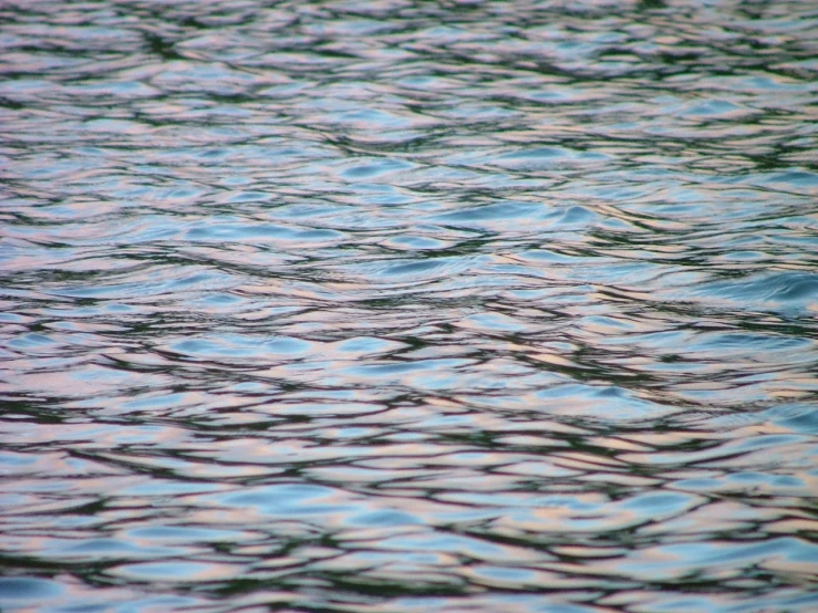 some blue water and ripples in it