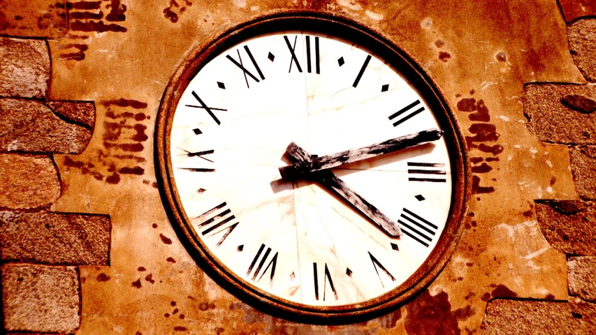 a large clock has roman numerals on it