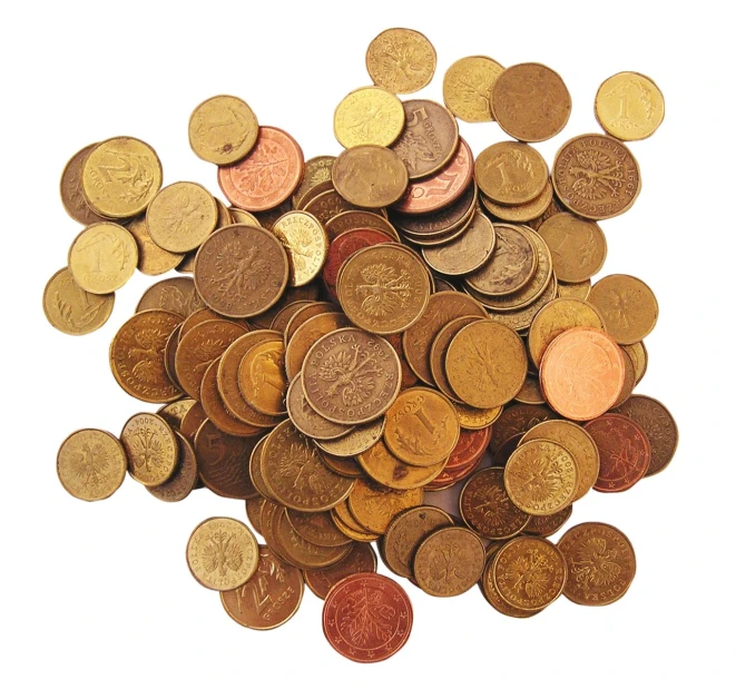 a pile of golden coins on a white background