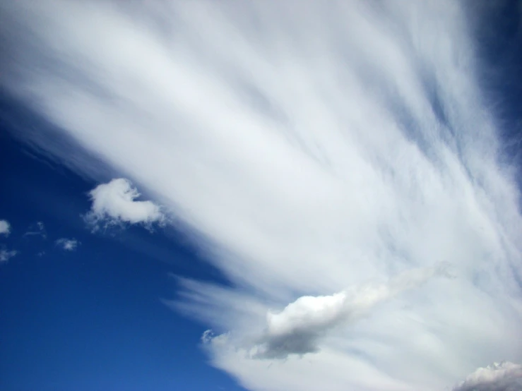 a cloud filled blue sky with white clouds