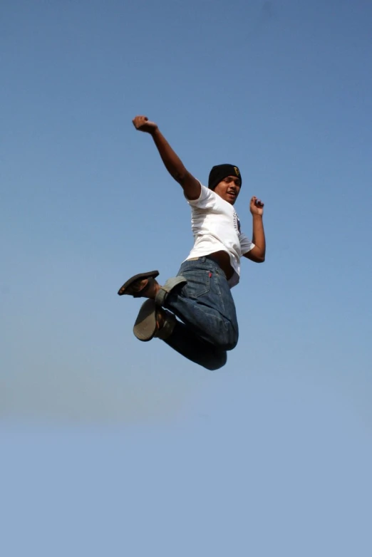 a person jumping in the air on a skateboard