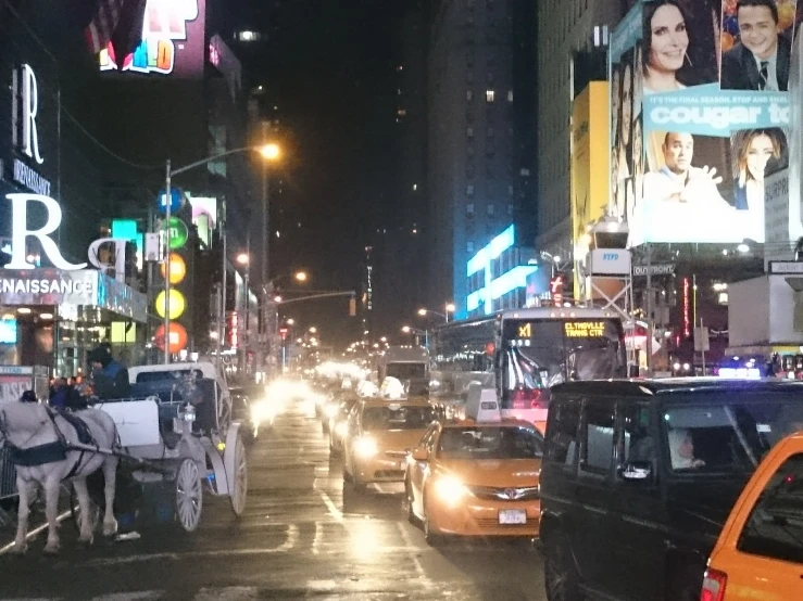 a busy city street filled with lots of traffic