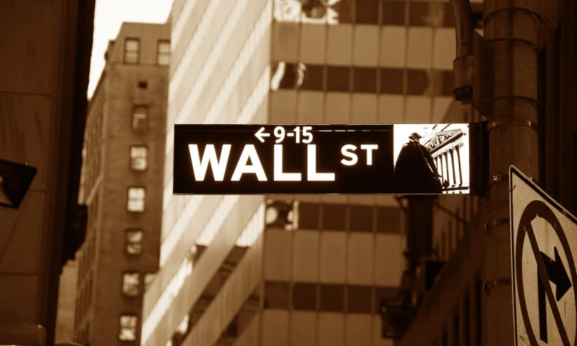 street sign showing wall st and west 79th street