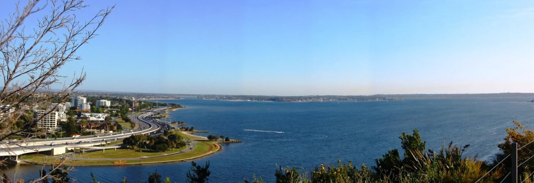 a large body of water that is surrounded by trees