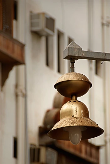 a bell is suspended over a metal rack