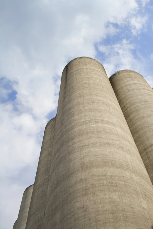 a tall cement structure with two stacks at the top