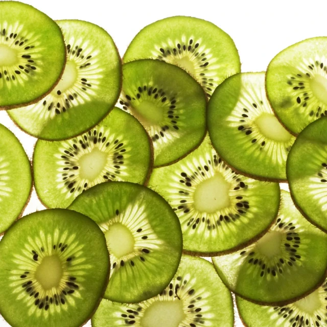 a pile of kiwi slices are arranged in the middle