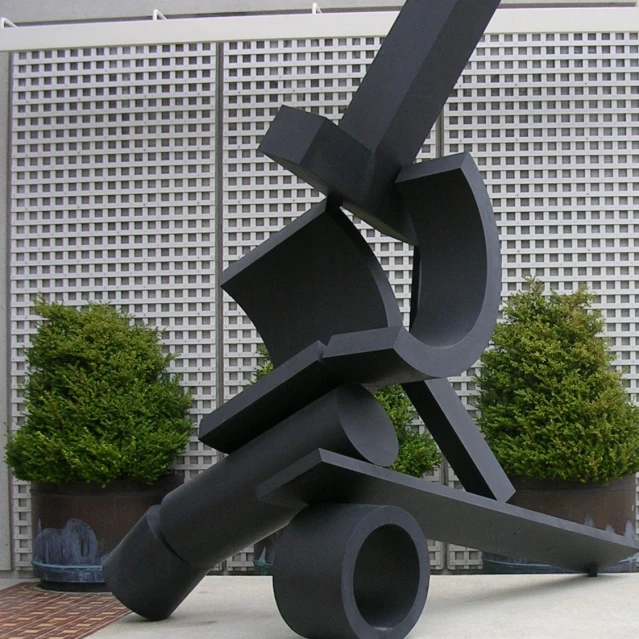 the sculpture is being displayed in front of a building