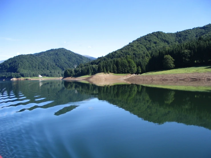 a lake with mountains in the background