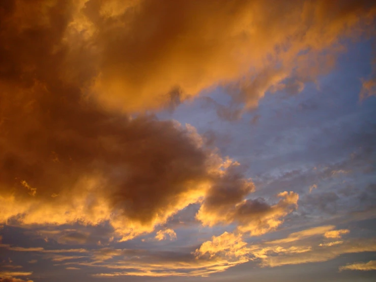 the sky has a brown glow from the sun