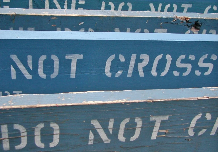 three signs with words written on them are blue