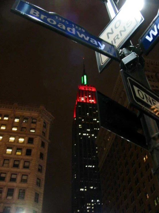 an intersection with a very tall building in the back