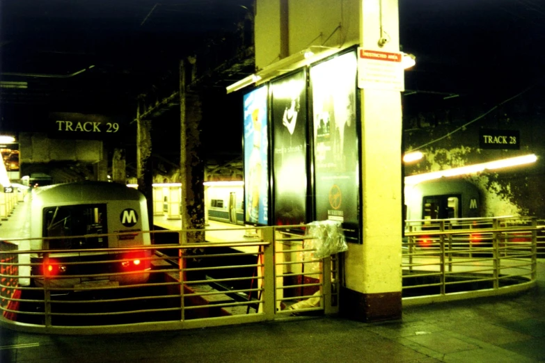 a view of a train station with red lights on