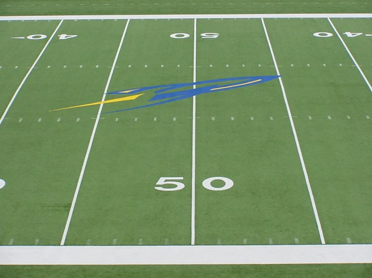 a large football field with numbers and a big clock