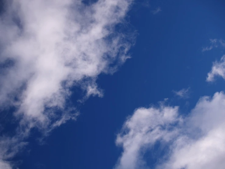 a view of the clouds in the blue sky