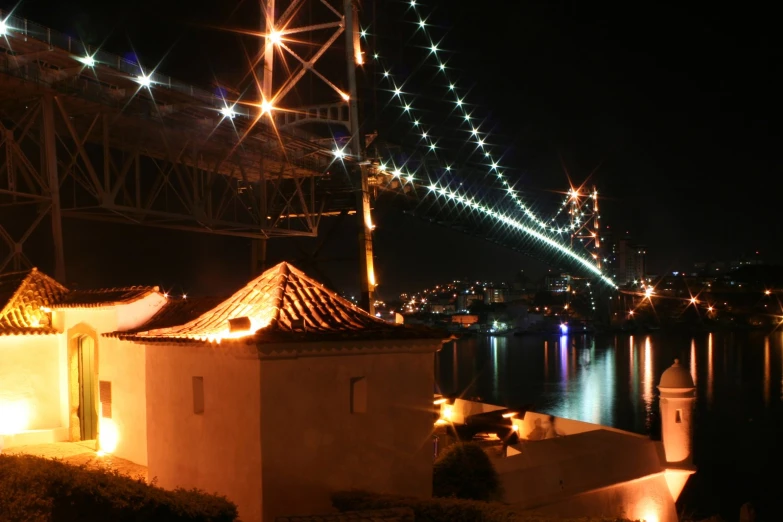 a view of a very pretty bridge with lights on it