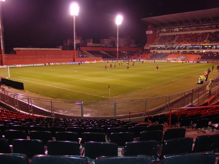 the people are playing soccer on the field