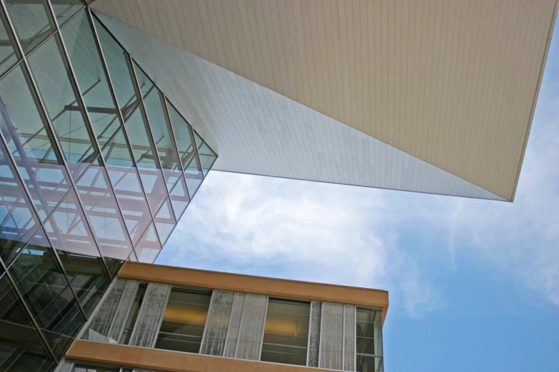 an image of the side of a building that is under glass