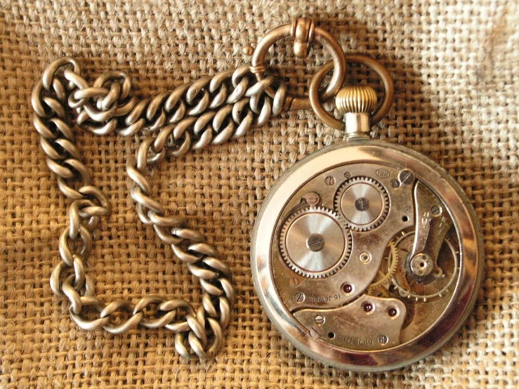 an old pocket watch being displayed in a picture