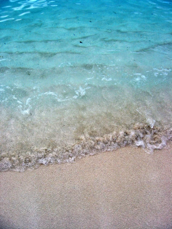 a picture taken from the sand of a beach