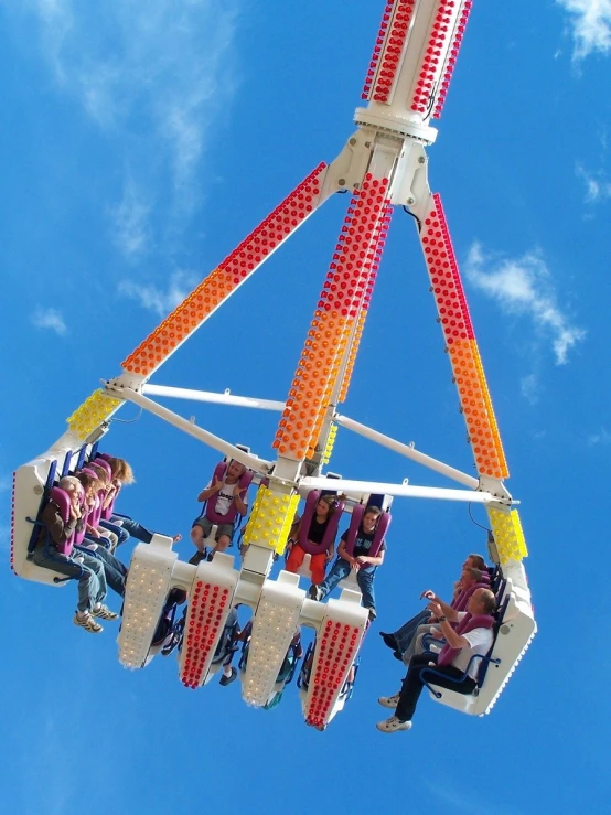 a group of people ride in an amut park