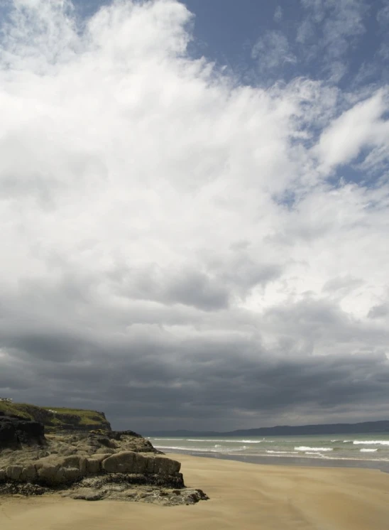 a couple of large rock formations near the water