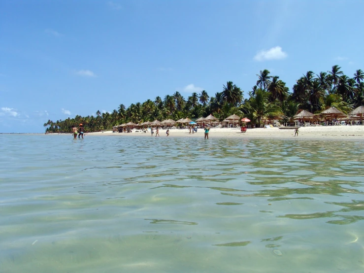 an island is on the side of a beach