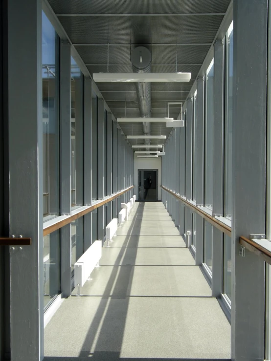 a long hallway filled with lots of windows