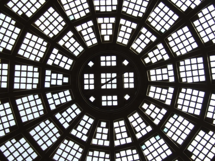 the underside view of a circular window in a building