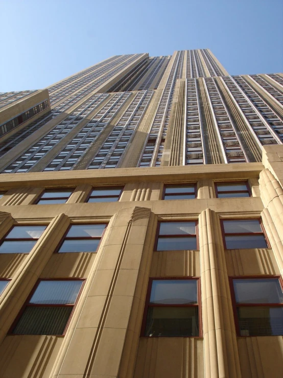 looking up at a very tall building in the city