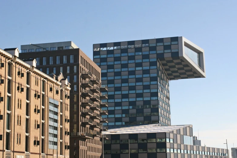 buildings are in the foreground as a bus drives by