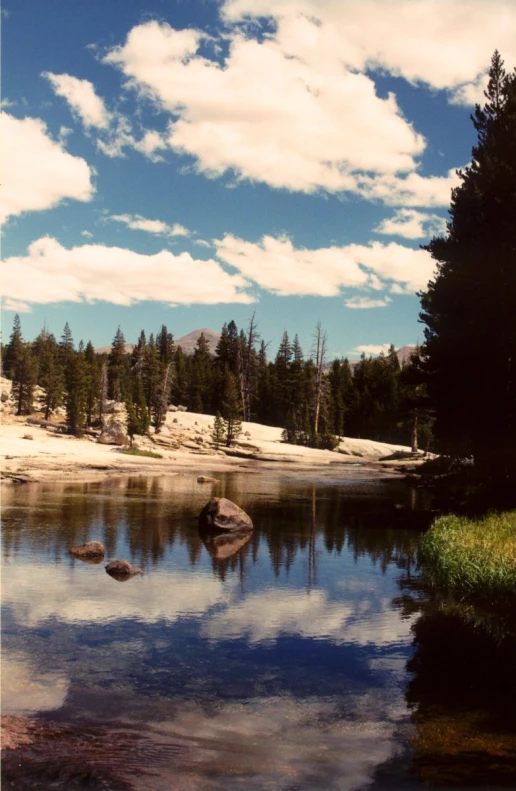 some rocks in a large body of water