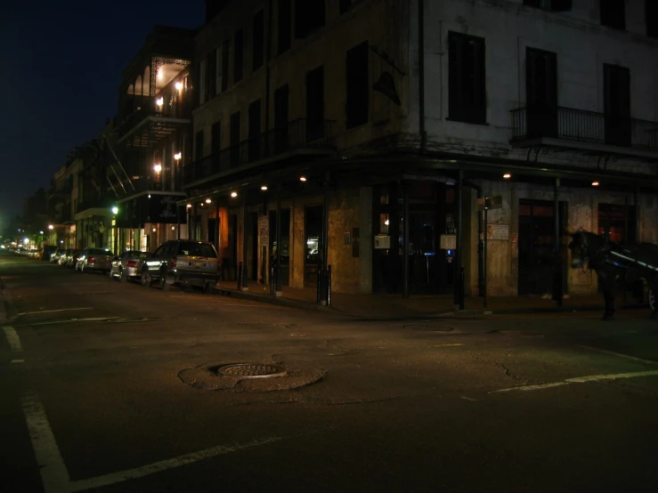 an empty street at night with no traffic