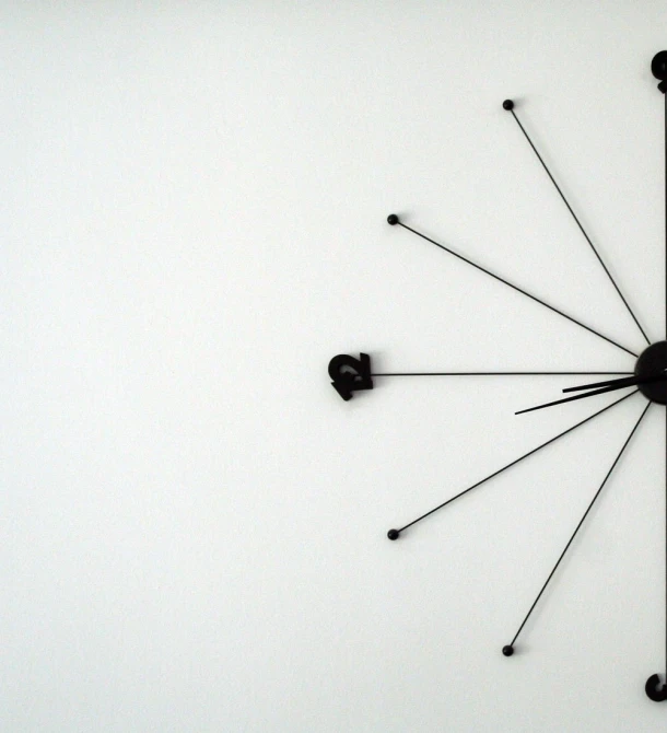 a modern clock face on the side of a wall