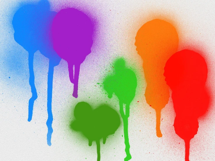 four colorful spray drops on the side of a wall