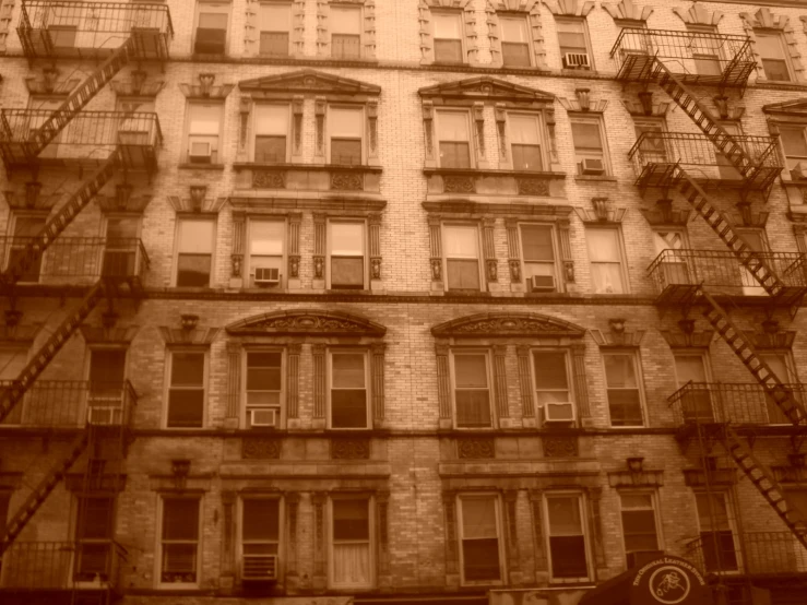 an old brick building with stairs leading up to it