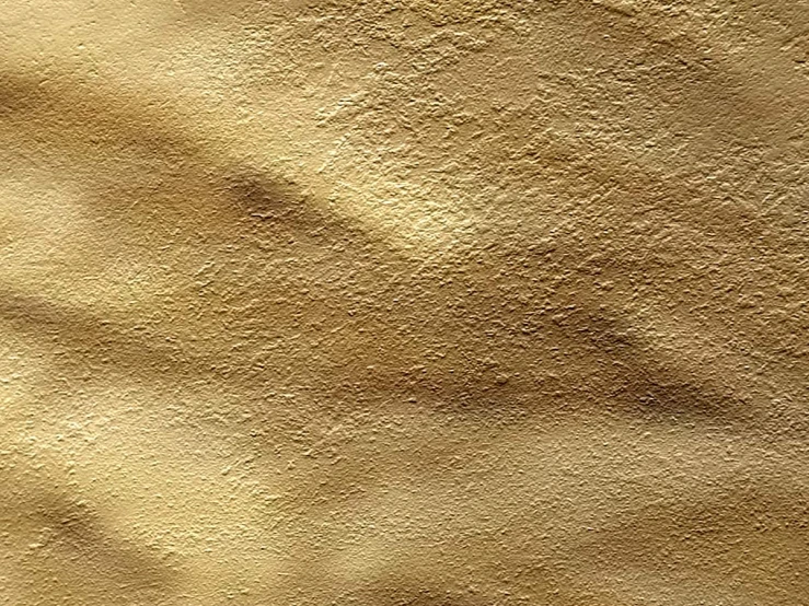 a wall with gold paint on it