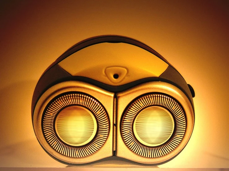 a close up of a speaker with an object near by